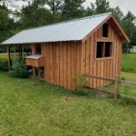 12x24 chicken shed covered in cedar planks in board and batten style