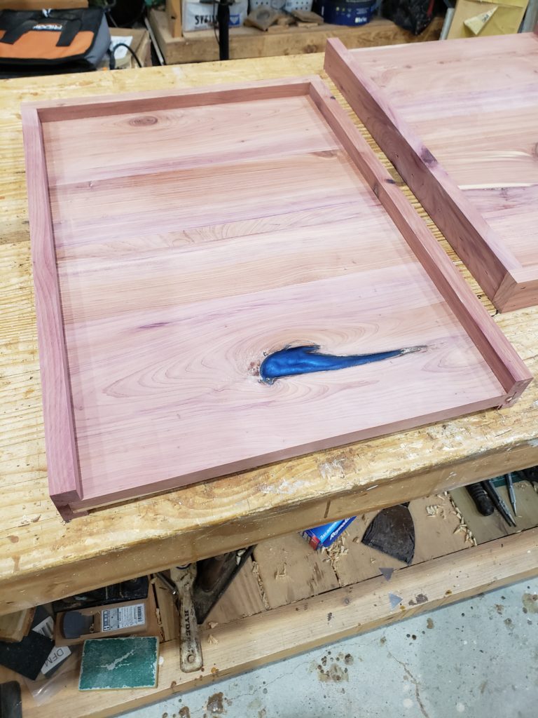 Bottom board with epoxy filler